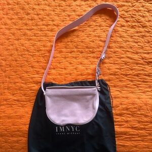 Isaac Mizrahi Soft Pink Crossbody Bag. Worn once, my jeans rubbed onto the bag.
